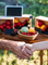 Farmers shake hands with fresh produce in the background